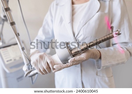 Closeup of carbon dioxide laser with phallic attachment for vaginal rejuvenation. Hardware cosmetology and medicine. Skin tightening