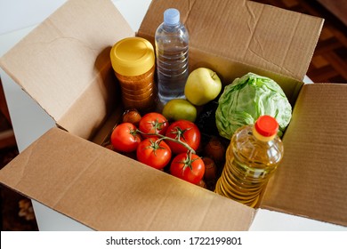 Close-up Cardboard Box With Different Fresh Packed Food Products. Safe Delivery Concept. Social Food Donation. Safe Contactless Home Food Delivery. Selective Focus.