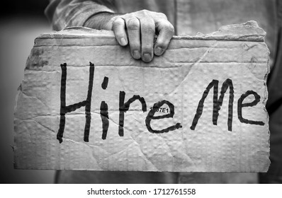 Closeup Of Cardboard Sign, Hire Me, Handwritten, Man Holding, Unemployed, Job, Out Of Work, Unemployed, Downsized, Job Loss, Fired, Discharged Worker, Pandemic, Job Market, Economy, Hired, Layoffs