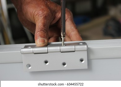 Close-up Carpenter Process Of Door Hinge Installation
