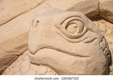 Closeup of the carved head of a sea turtle at a sandsculpting festival in morning sunlight on an island beach along the Gulf Coast of west central Florida. For motifs of ephemeral art, make-believe. - Powered by Shutterstock