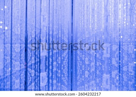 A close-up of cascading blue light patterns at teamLab Borderless, showcasing the intricate digital movement in this immersive interactive art installation, November 16, 2022