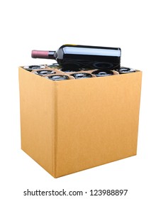 Closeup of a case of wine with one bottle resting on top. Isolated on white.