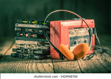 Closeup Of Cassette Tape, Red Walkman And Headphones