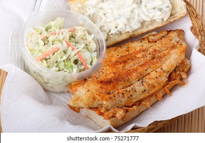 Closeup Of A Catfish Fillet Sandwich With Coleslaw In A Basket