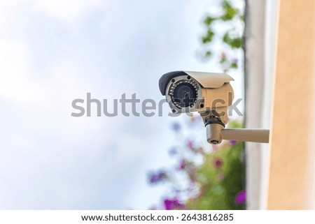 Close-up, CCTV camera on a multi-storey building