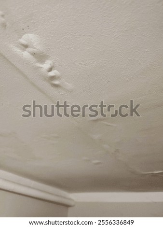 Close-up of ceiling with water damage
