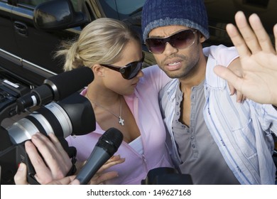 Closeup Of Celebrity Couple And Paparazzi