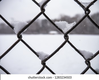 Closeup Chain Link Fence Covered in Snow - Powered by Shutterstock