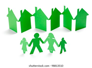 Closeup Of Chain Of Paper People And Houses Cut On White Background