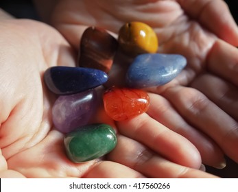 Close-up Of Chakra Stones In Woman Hand