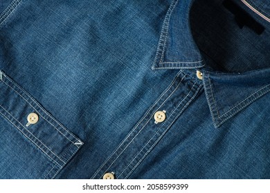 Closeup of Chambray jeans shirt, cloth and textile background concept