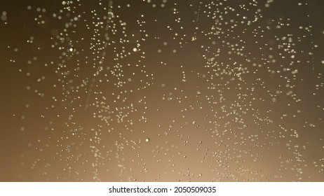 Close-up Of Champagne Bubbles Background. Texture Of Beverages Background.