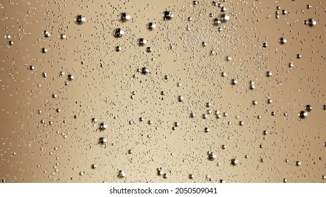 Close-up of champagne bubbles background. Texture of beverages background.