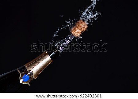 Close-up of champagne explosion