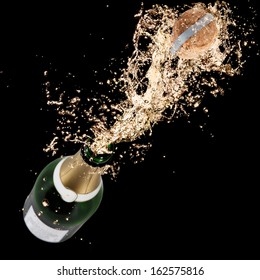 Close-up of champagne explosion. Celebration theme.