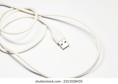 Close-up charger cable on isolated white background, usb, aux - Shutterstock ID 2311028435