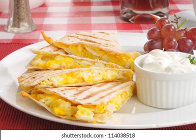 Closeup Of A Cheese And Egg Quesadilla With Grapes