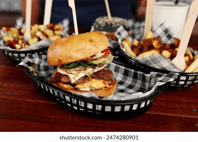 Close-up of a cheeseburger with fries served in a basket at a casual dining restaurant - Powered by Shutterstock