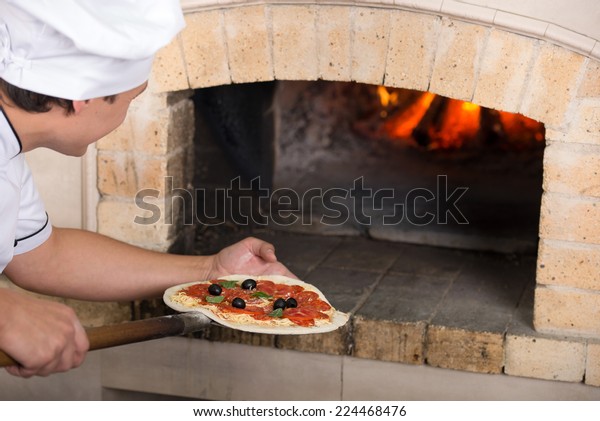 Closeup Chef Inserts Pizza Oven Stock Photo Edit Now 224468476