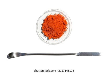 Closeup Chemical Ingredient On White Laboratory Table. Lead(II,IV) Oxide In Chemical Watch Glass Place Next To The Stainless Spatula. Top View