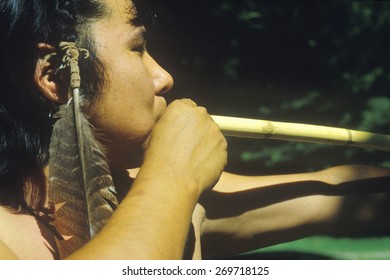 Close-up Of Cherokee Using A Blow Gun, Tsalagi Village, Cherokee Nation, OK