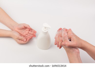 Closeup of children washing hands isolated. Cleanliness and body care concept. Global Handwashing Day Concept/Washing hands with soap  - Powered by Shutterstock