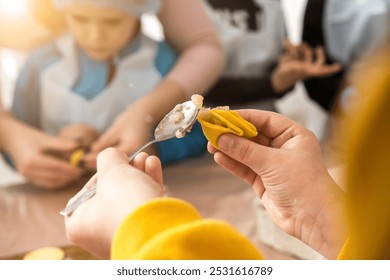 A close-up of a children's ravioli-making workshop, capturing the creativity and excitement of young chefs learning to prepare delicious homemade pasta in a culinary class - Powered by Shutterstock