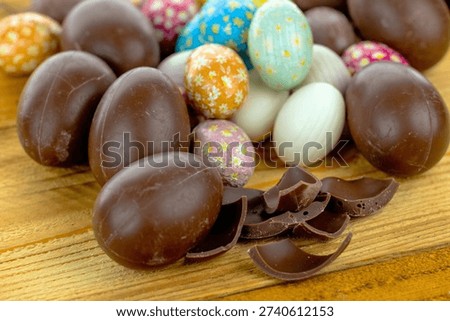 Close-up of chocolate Easter eggs on wooden background