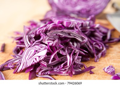 Closeup of Chopped Red Cabbage on Wooden Cutting Board - Powered by Shutterstock
