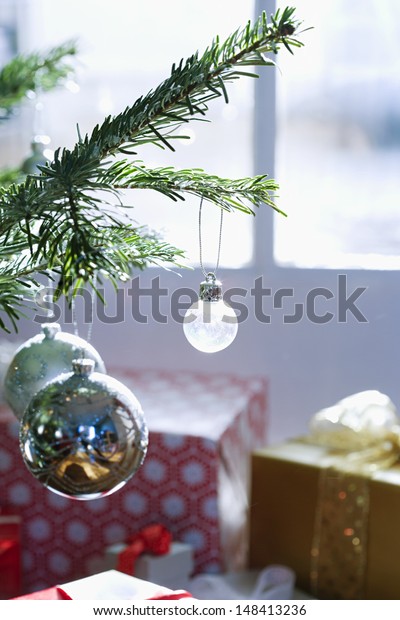 Closeup Christmas Decorations Hanging On Branches Stock Photo