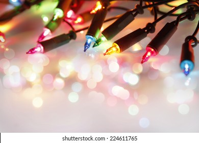 Closeup of Christmas lights glowing 