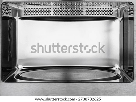 Close-up of chrome microwave interior.