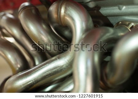 Close-up of Chrome Pipes of a Car Engine