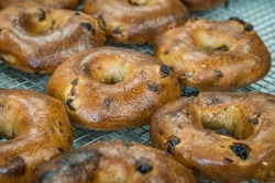 Close-up Of Cinnamon Raisin Bagels Fresh Out Of The Oven With Selective Focus.