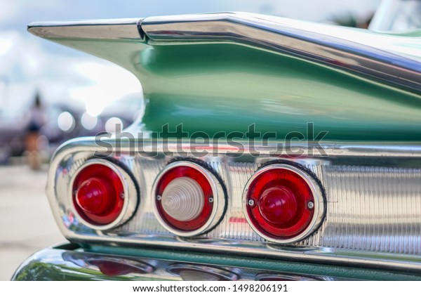 A close-up of a classic American  vintage\
automobile, selective focus