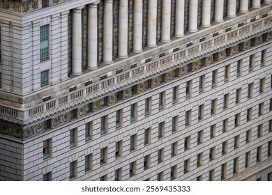 Close-up of a classical-style building facade with rows of windows, decorative columns, and intricate architectural details in Los Angeles.