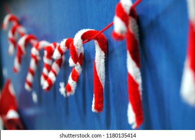 Close-up Of Classroom Door Decoration, Candy Canes Made Of Pipe Cleaners In Red And White Colors, In Soft Focus In The Background.