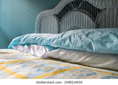 Closeup Of Clean Bed Vintage Beach Theme Decorative Blue Pillows In Bedroom Home, House Or Apartment And Headboard