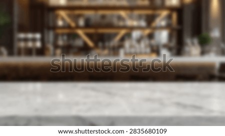 A close-up of a clean, empty marble bar counter in a modern, dimly lit lounge with a blurred background of shelves stocked with bottles.