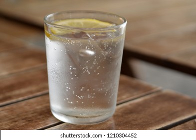 Closeup Of A Clear Glass Of Seltzer Water With A Slice Of Lemon