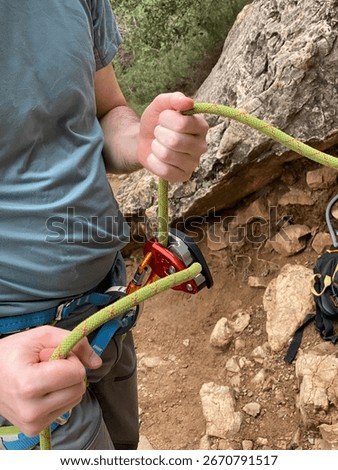 Closeup of Climber using grigri devise in the crag 