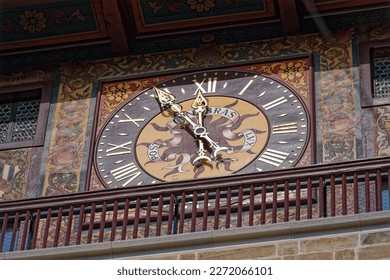 Close-up of clock face of stone clock tower at pont de l'Ile at Swiss City of Geneva on a sunny late winter day. Photo taken March 5th, 2023, Geneva, Switzerland.