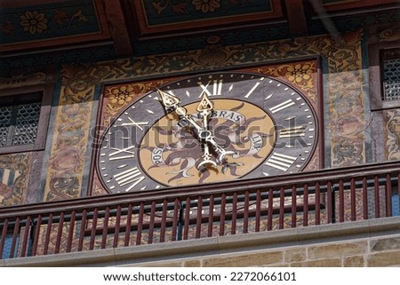 Close-up of clock face of stone clock tower at pont de l'Ile at Swiss City of Geneva on a sunny late winter day. Photo taken March 5th, 2023, Geneva, Switzerland.
