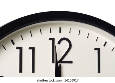 Closeup Of A Clock Showing One Minute To Midnight