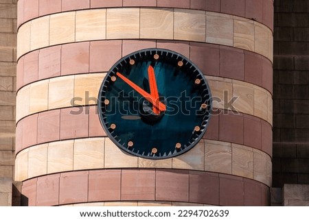 Close-up of the clockface on the exterior of the building at No 1 Poultry in the city of London, UK.