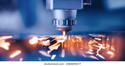 Closeup CNC gas cutting metal sheet, sparks fly. Blue steel color, modern industrial technology - Powered by Shutterstock