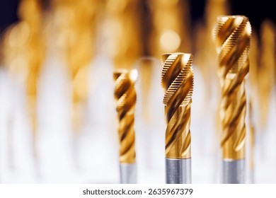 Close-up of cnc machine drill bits with golden coating for precision engineering.
