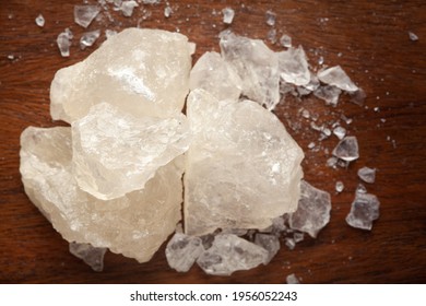 Close-up Of Coarse Fitkari ( Potassium Alum)  On Wooden Top Background. Top View