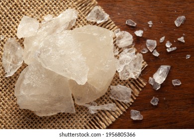 Close-up Of Coarse Fitkari ( Potassium Alum)  On The Wooden Top Background And Jute Mat. Top View